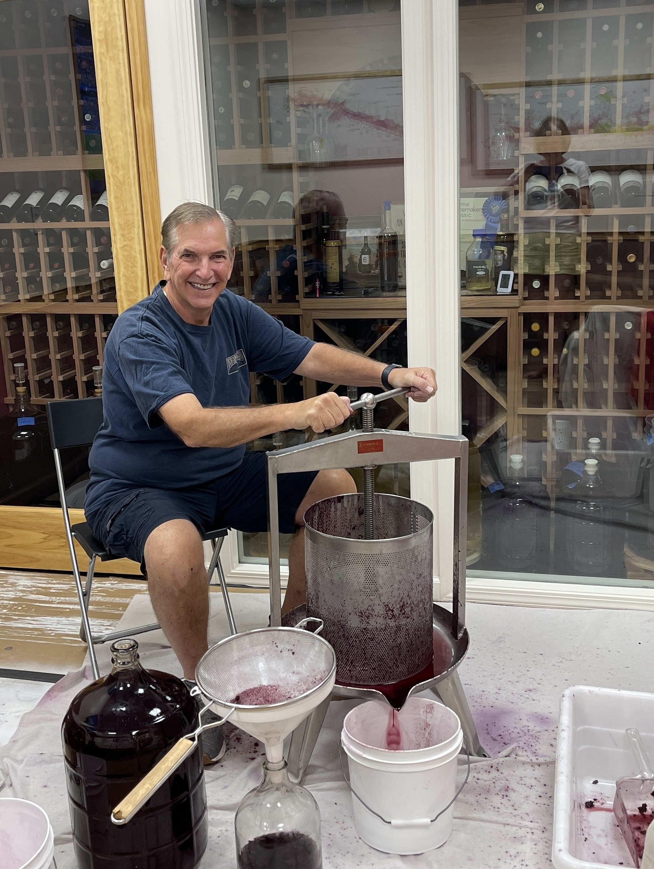 Maury Green pressing grapes with a basket press